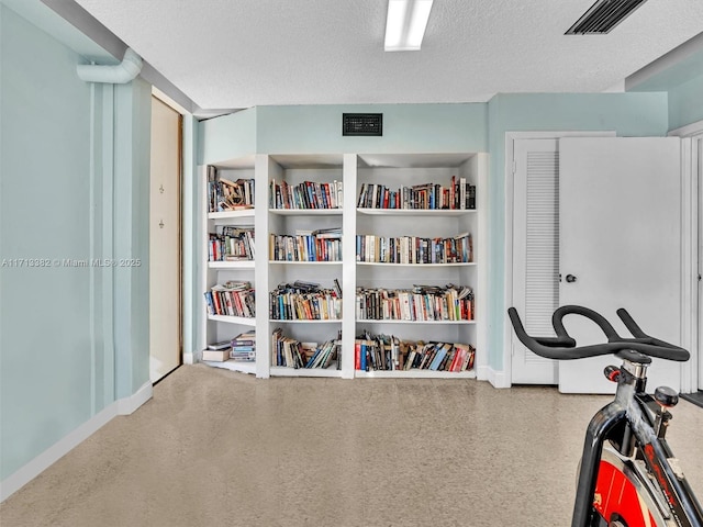 interior space with a textured ceiling