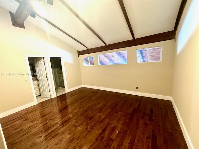 empty room featuring light hardwood / wood-style flooring, beamed ceiling, and high vaulted ceiling