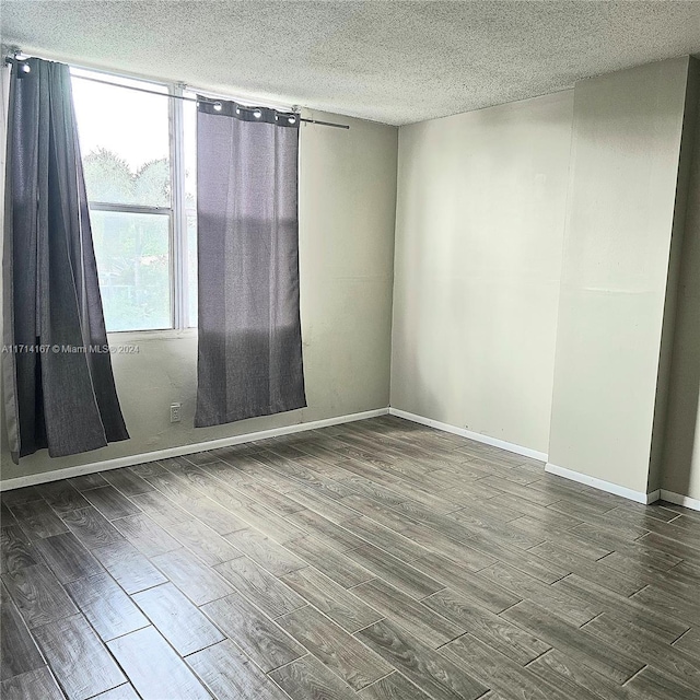 empty room with a textured ceiling