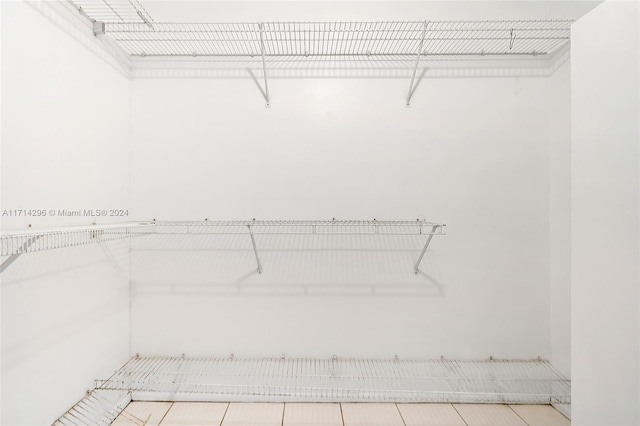 spacious closet featuring light tile patterned floors