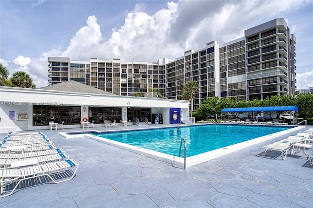 view of swimming pool with a patio