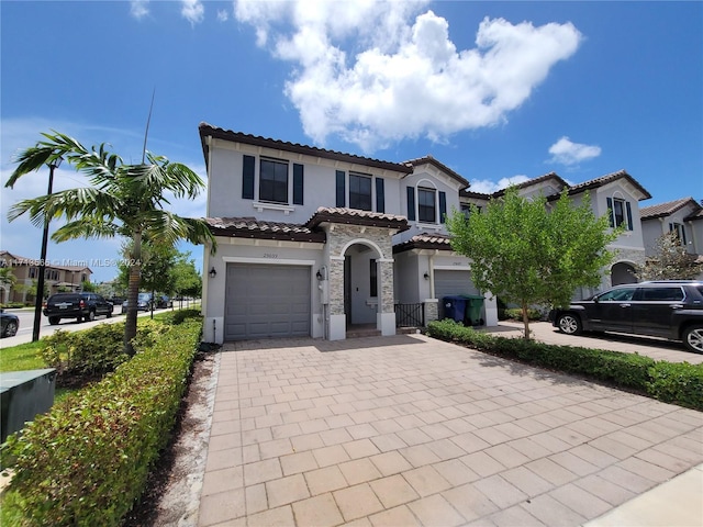 mediterranean / spanish-style home featuring a garage