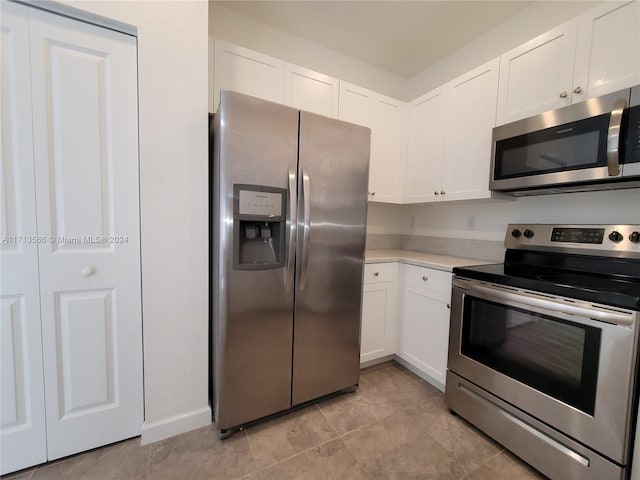 kitchen featuring white cabinetry and stainless steel appliances