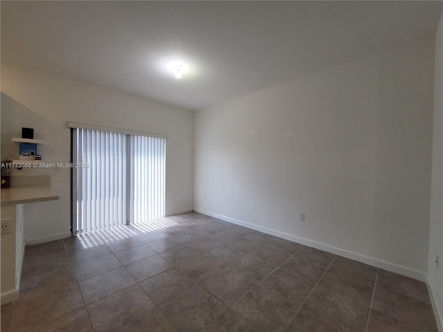 view of tiled spare room