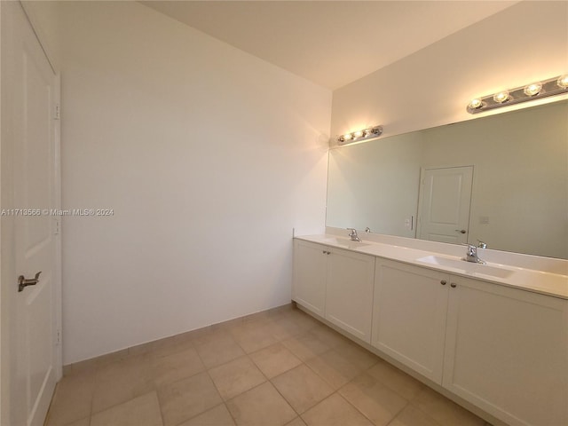 bathroom featuring tile patterned flooring and vanity