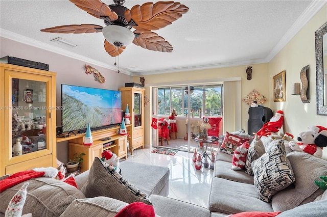 living room with ceiling fan, ornamental molding, and a textured ceiling