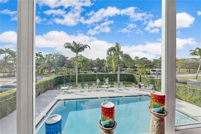 view of swimming pool featuring a patio area