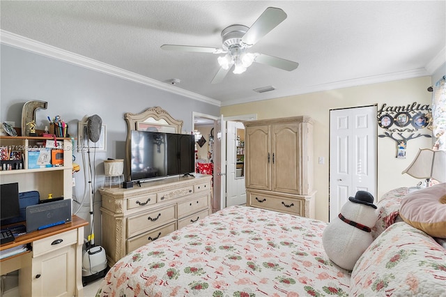 bedroom featuring ceiling fan, a textured ceiling, and ornamental molding