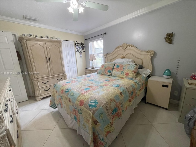 126 Sparrow Dr Unit 22B, Royal Palm Beach, FL 33411 - bedroom with ornamental molding, light tile patterned floors, a ceiling fan, and a closet