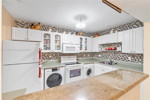 126 Sparrow Dr Unit 22B, Royal Palm Beach, FL 33411 - kitchen with white appliances, washer / dryer, decorative backsplash, a textured ceiling, and white cabinets