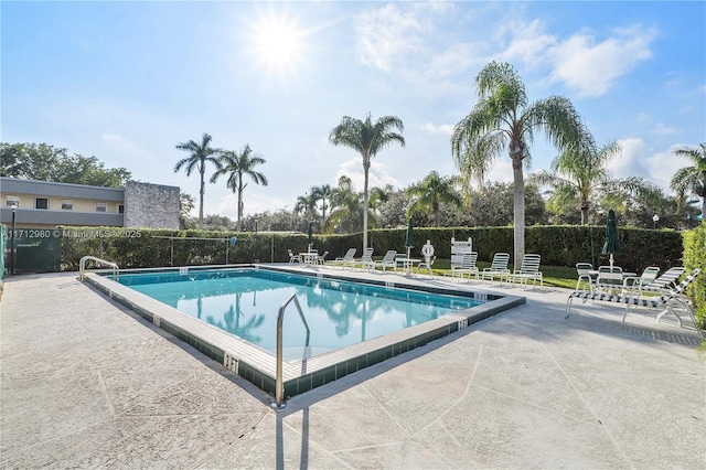 126 Sparrow Dr Unit 22B, Royal Palm Beach, FL 33411 - community pool featuring a patio area
