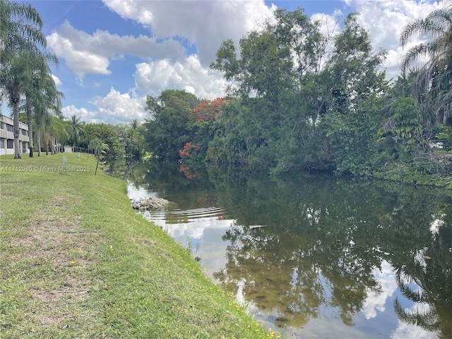 126 Sparrow Dr Unit 22B, Royal Palm Beach, FL 33411 - water view featuring a forest
