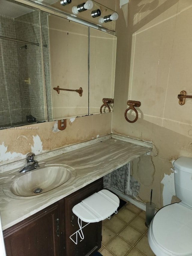 bathroom with tile patterned floors, vanity, and toilet