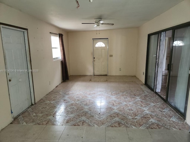 foyer featuring ceiling fan