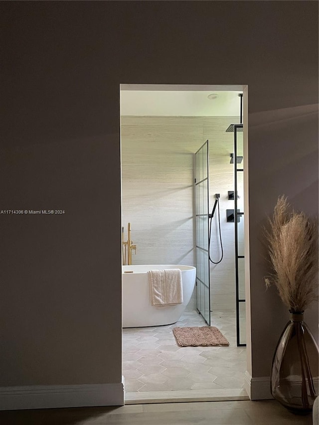 bathroom featuring a tub to relax in