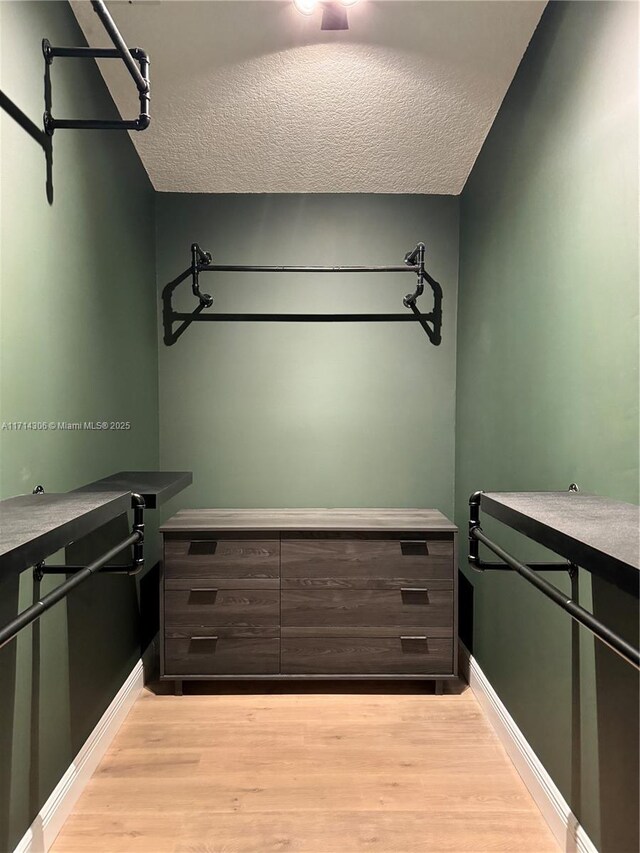 bathroom with vanity, toilet, and walk in shower