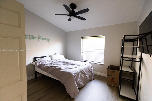 bedroom with dark hardwood / wood-style flooring and a textured ceiling