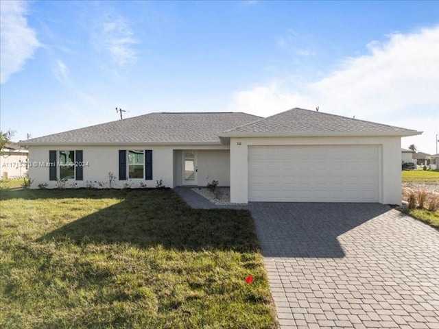 ranch-style home with a front yard and a garage