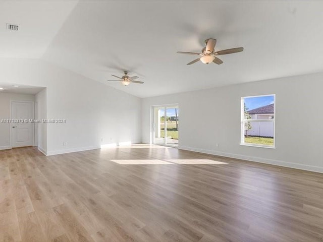 spare room featuring ceiling fan, light hardwood / wood-style flooring, and vaulted ceiling