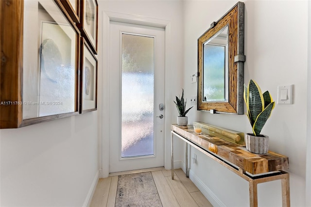 doorway with light hardwood / wood-style flooring