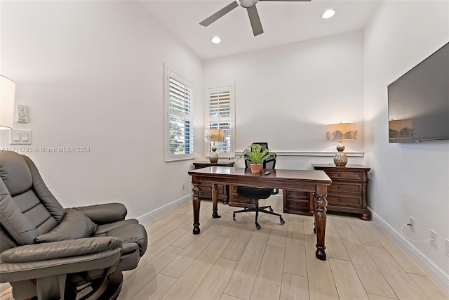 office space featuring ceiling fan and light hardwood / wood-style floors