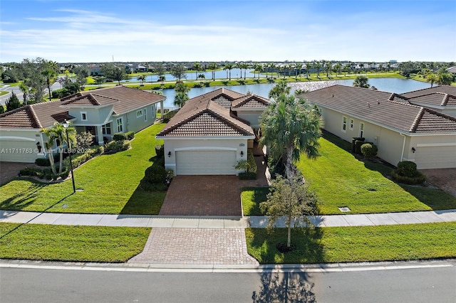 birds eye view of property with a water view