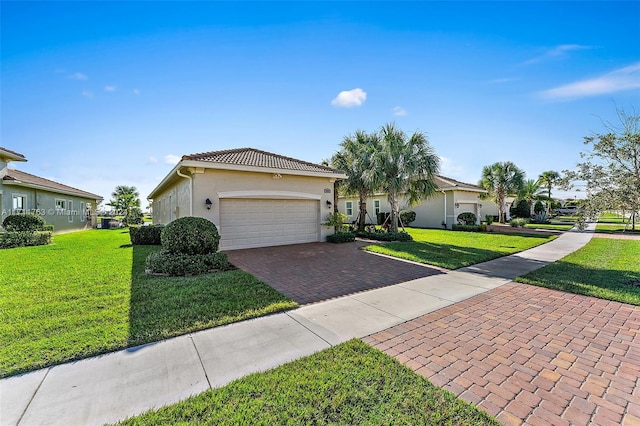 view of front of house with a garage and a front lawn