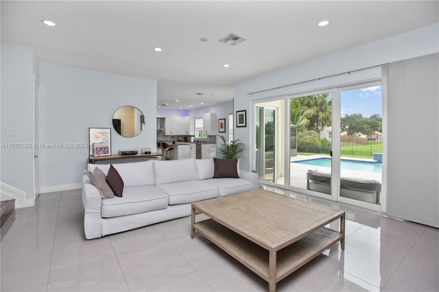 living room with light tile patterned flooring