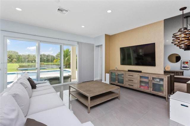10410 Ranchette Dr, Cooper City, FL 33328 - living area with light tile patterned flooring and recessed lighting