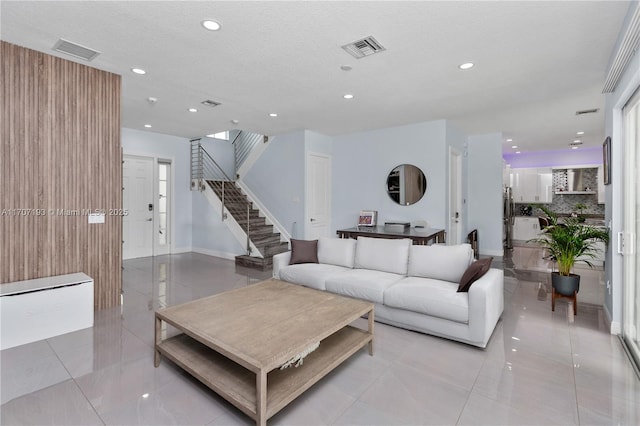 10410 Ranchette Dr, Cooper City, FL 33328 - living room with recessed lighting, stairs, light tile patterned floors, and baseboards