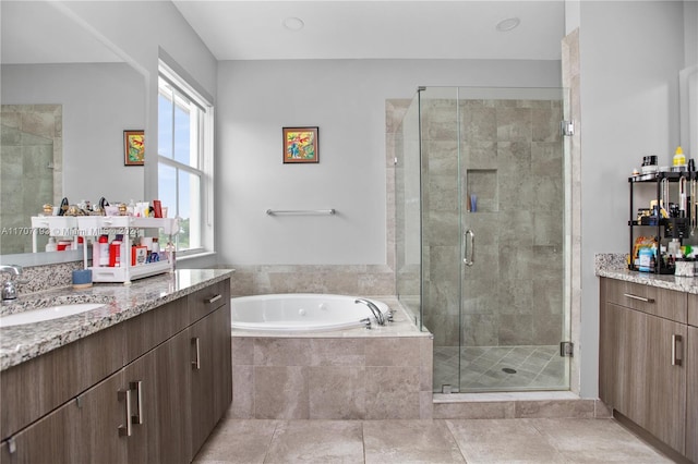 bathroom featuring tile patterned floors, vanity, and plus walk in shower