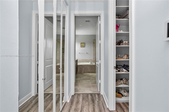 10410 Ranchette Dr, Cooper City, FL 33328 - walk in closet with wood finished floors