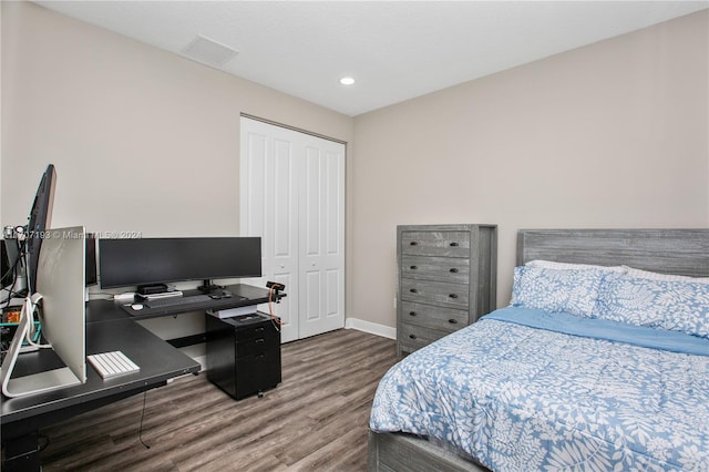 bedroom with hardwood / wood-style flooring and a closet