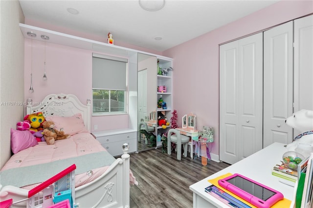 bedroom featuring a closet and dark hardwood / wood-style flooring