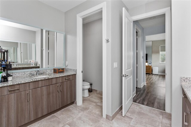 10410 Ranchette Dr, Cooper City, FL 33328 - bathroom featuring vanity, toilet, and baseboards