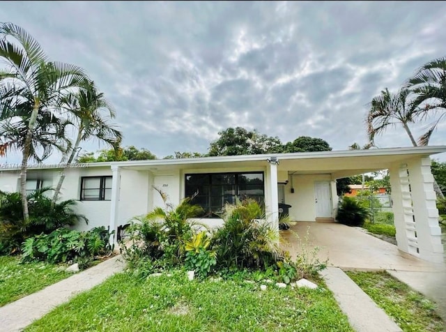 view of front of property with a carport