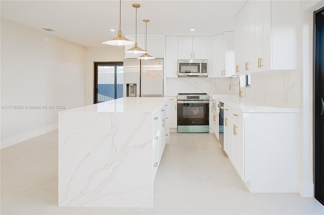 kitchen with sink, hanging light fixtures, decorative backsplash, white cabinetry, and stainless steel appliances