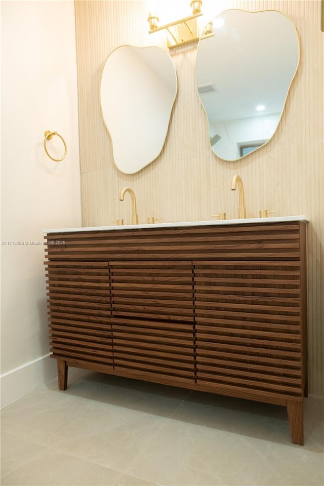 bathroom featuring tile patterned floors, vanity, and radiator