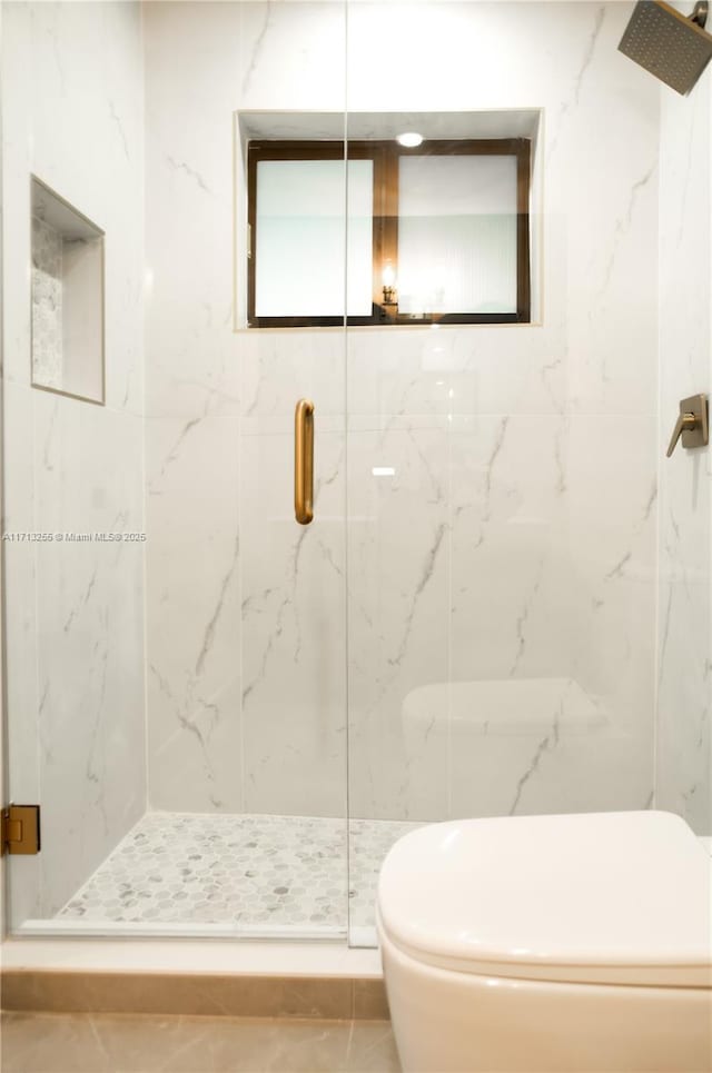 bathroom with tile patterned flooring, an enclosed shower, and toilet