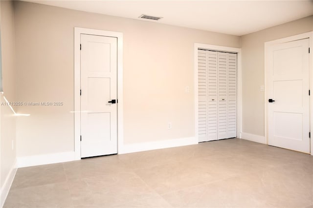 unfurnished bedroom with light tile patterned floors