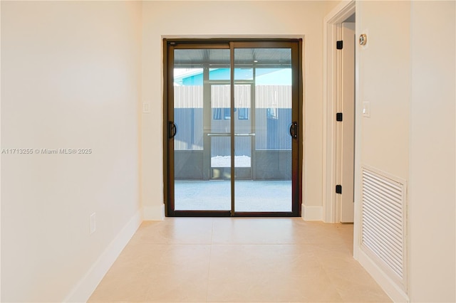 hallway featuring light tile patterned flooring