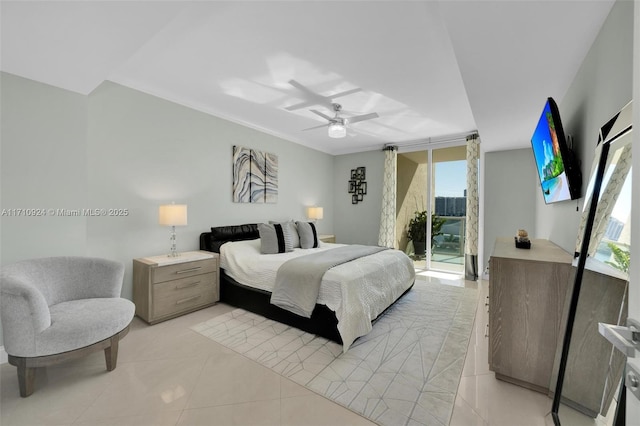 bedroom featuring crown molding, ceiling fan, access to outside, light tile patterned floors, and a wall of windows