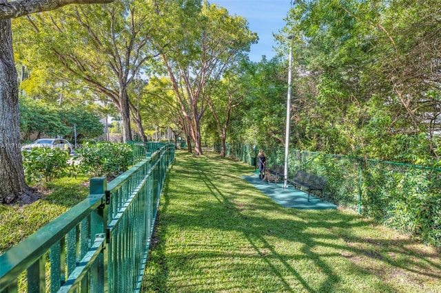 view of home's community with a yard