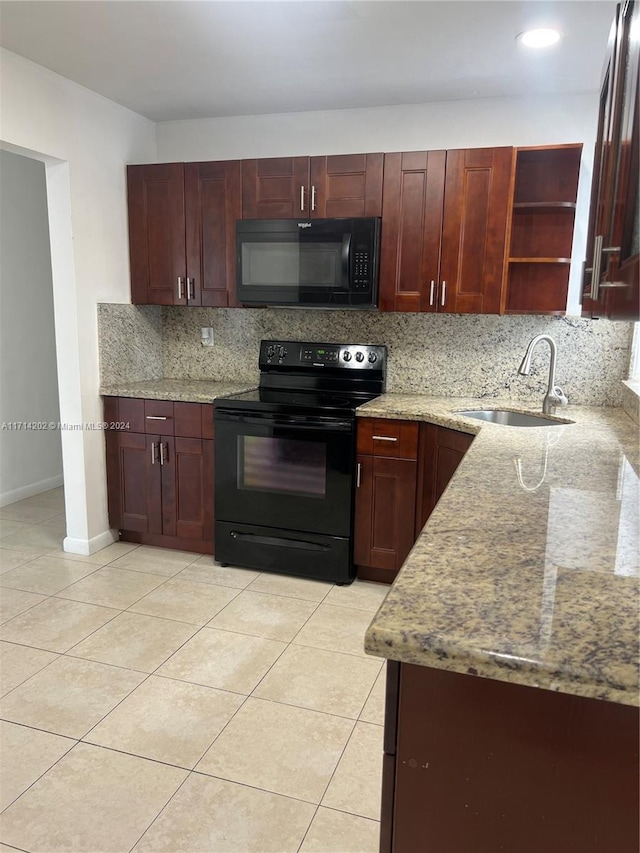 kitchen featuring backsplash, black appliances, sink, light stone countertops, and light tile patterned flooring