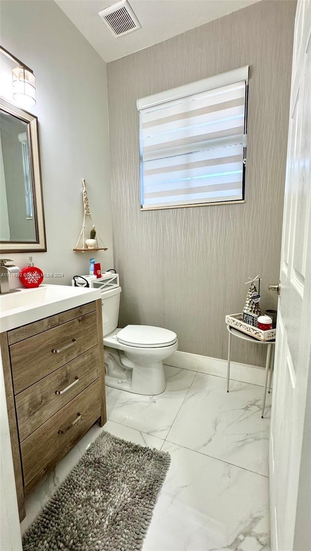 bathroom with vanity and toilet