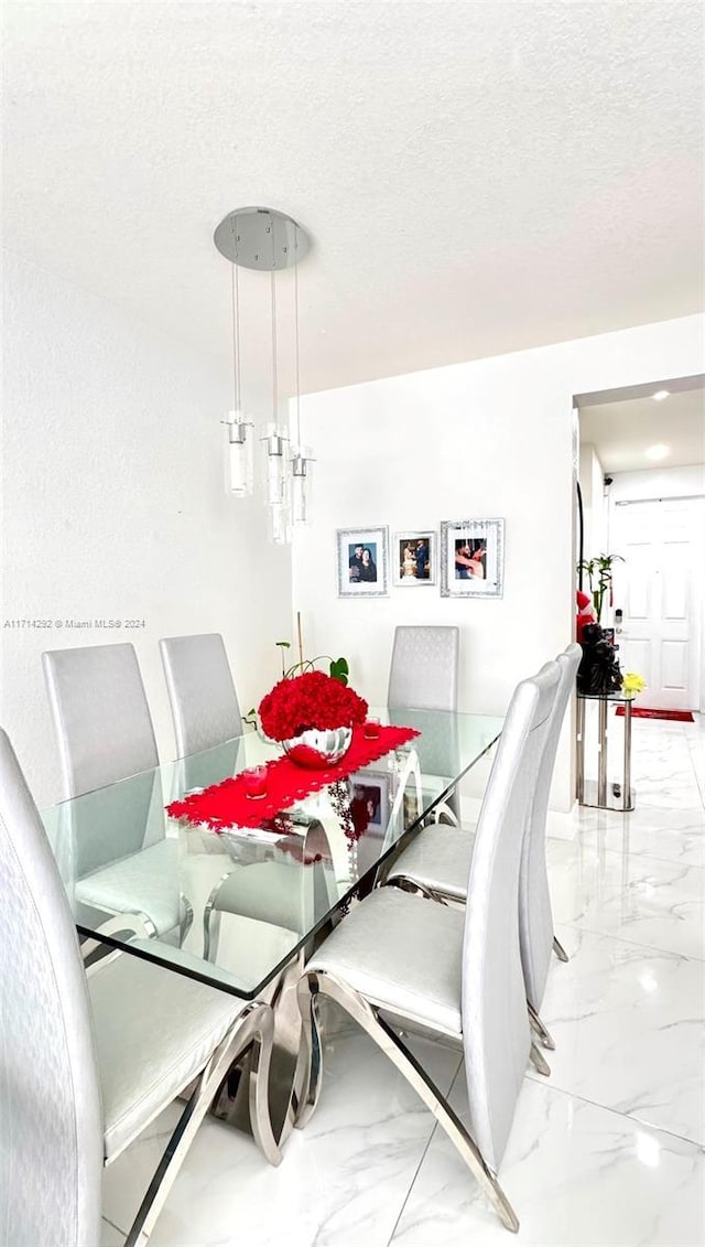 dining area with a textured ceiling