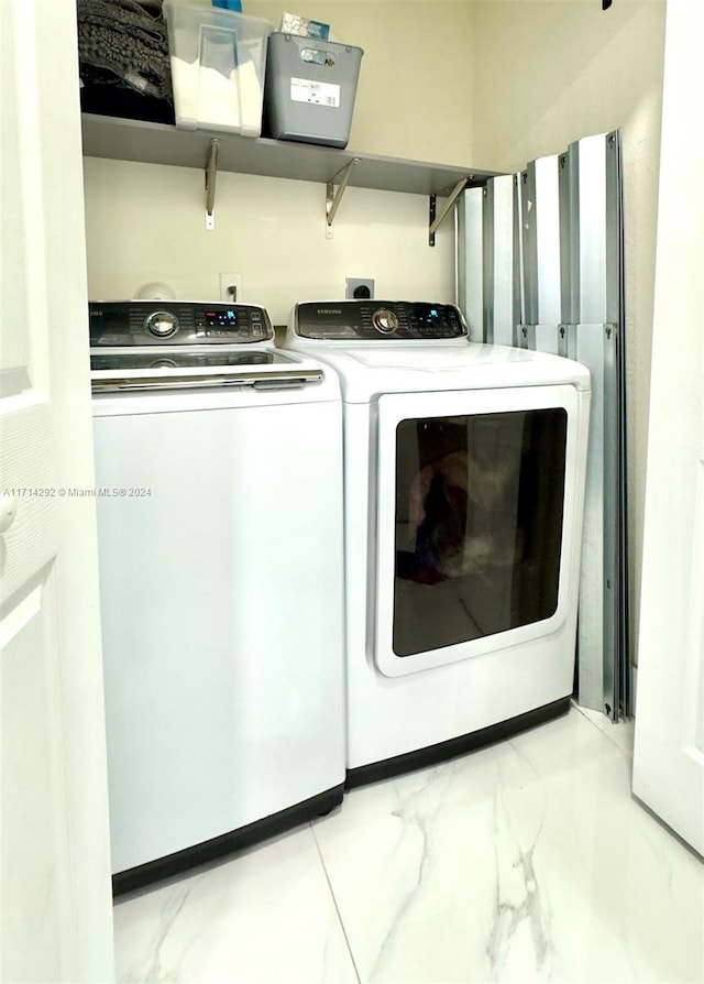 laundry room with separate washer and dryer