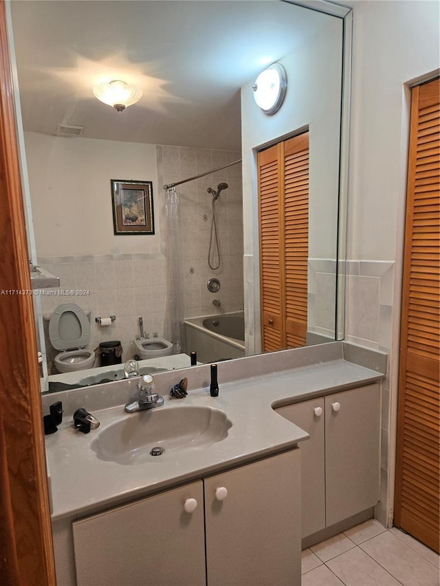 full bathroom with tile patterned flooring, tile walls, toilet, vanity, and shower / tub combo