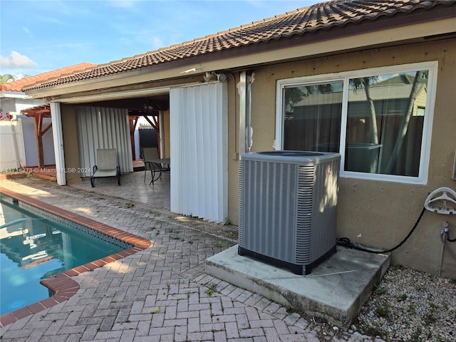 exterior space with a patio and central AC