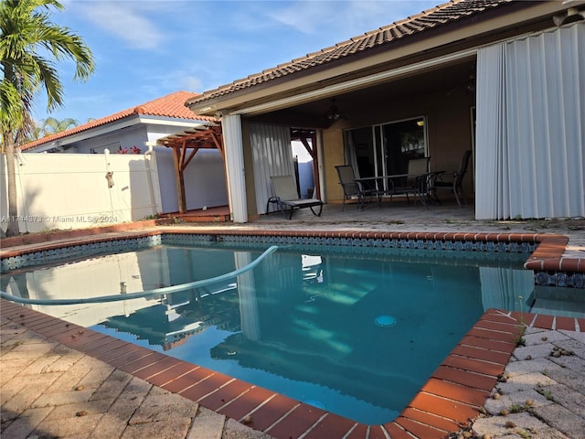 view of swimming pool with a patio area